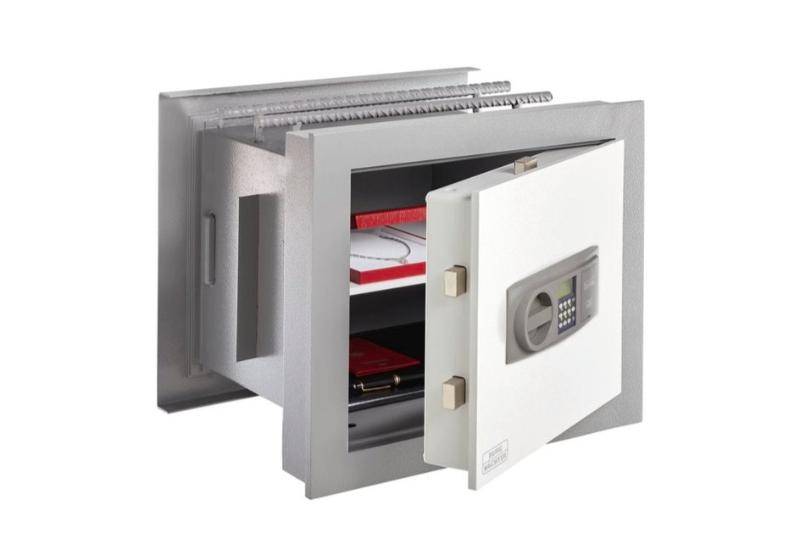 Open Burg Wachter WTD710 wall safe revealing internal shelves storing documents and jewelry, 37.8L Grade 1 secure storage.