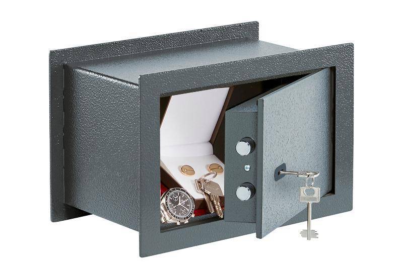 Open Burg Wachter PSW130 Pure Wall Safe, 1K Rated, 16.5 Litres with key lock showing jewelry and watch inside. Compact and secure wall-mounted safe.