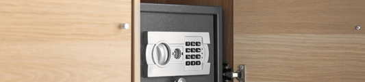 Secure home safe installed in wooden cabinet for protection.