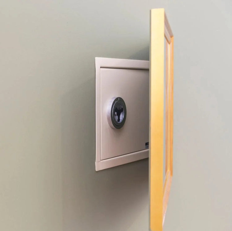 Secure wall safe with an open door, showcasing shelves for valuables.